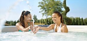 How can a hot tub help enhance your social life?