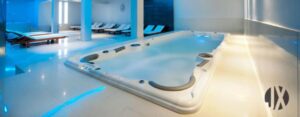 Why are swim spas perfect for hotels and health clubs to install?